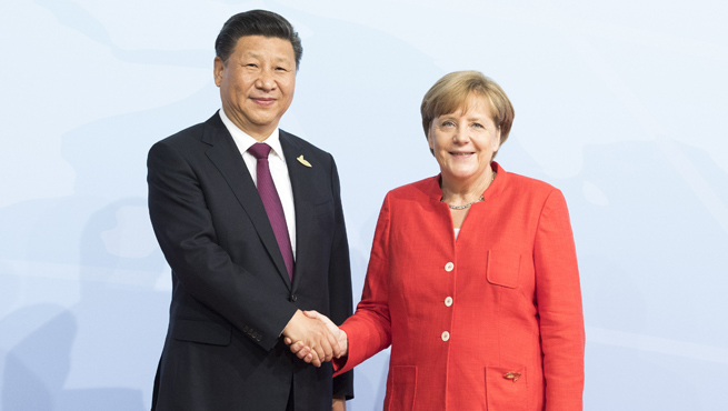 President Xi Jinping shakes hands with Chancellor Angela Merkel in Hamburg, Germany