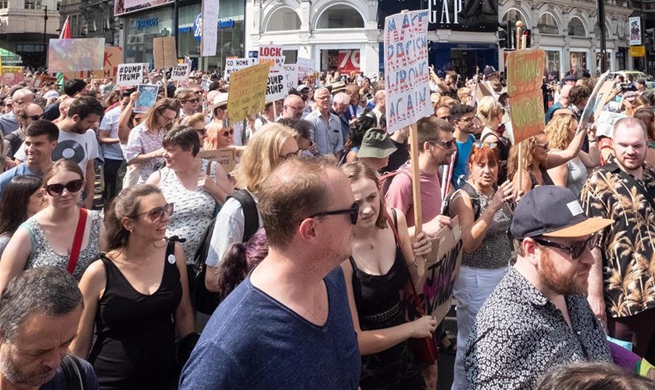 Tens of thousands of anti-Trump marchers gather in London