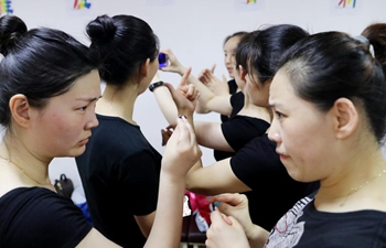 In pics: dance group composed of hearing-impaired people in Shanghai