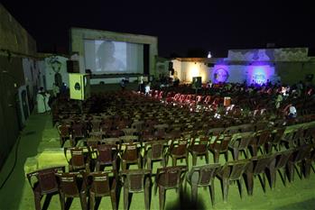 People watch movie in neighborhood of Khartoum North, Sudan